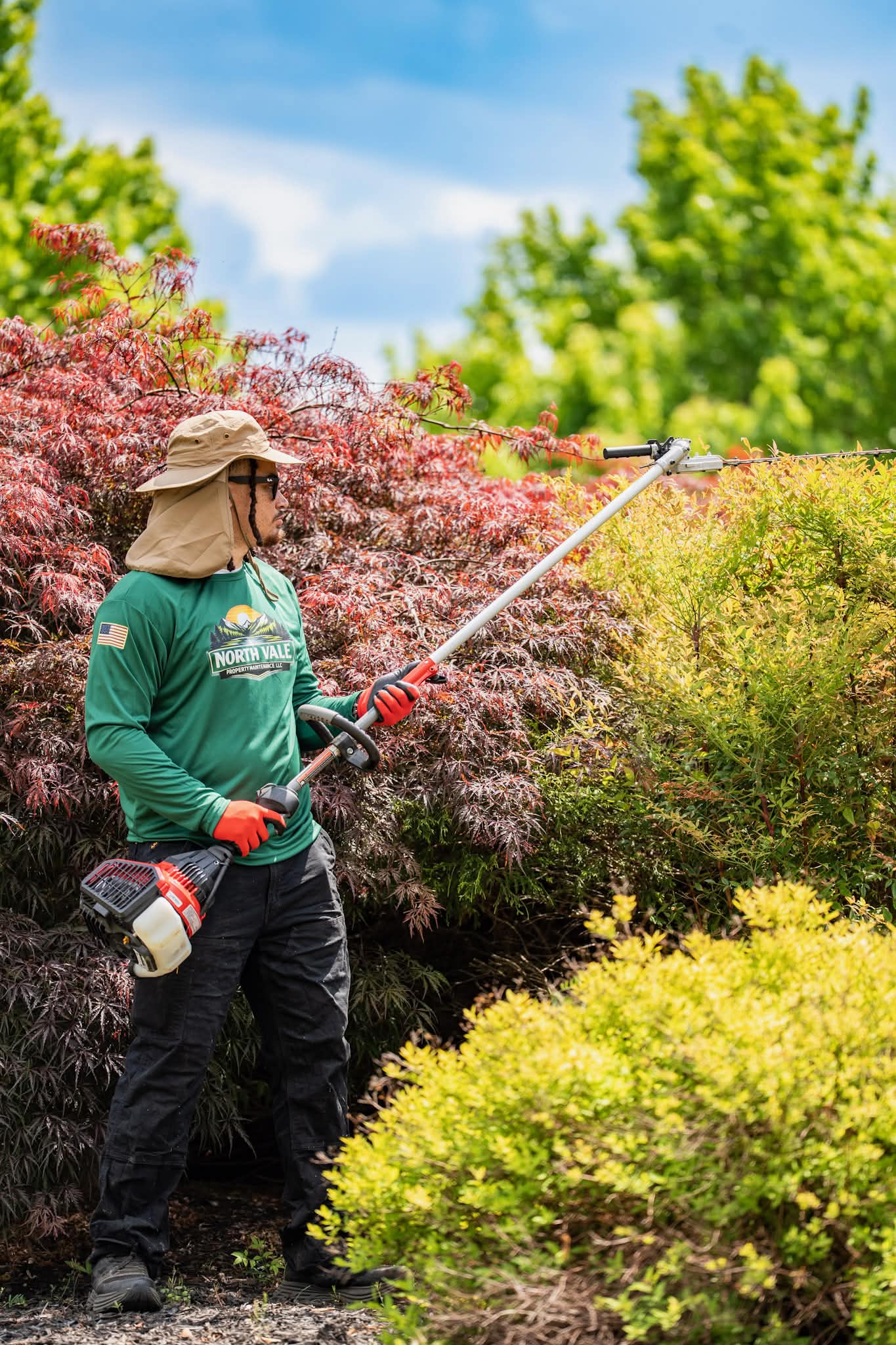 North Vale co-founder trimming hedges on-site